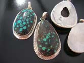 Turquoise colored gemstone set in abstract designed high quality 925 sterling silver  pendant