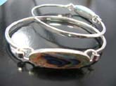 Opal colored gemstone in elongated oval shape on high quality 925 sterling silver  bangle bracelet