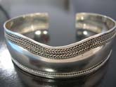 Double braided border along top of thick high quality 925 sterling silver  bangle bracelet and single braid band at bottom