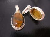 Filigree styled, high quality 925 sterling silver  pendant with tigers eye gem in center