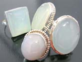 Fashion ring with large precious jade or moon gemstone framed and held by high quality 925 sterling silver 