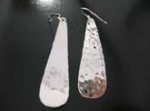 Crafted, elongated oval shaped high quality 925 sterling silver  earrings in hammered design 