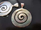 pendant jewelry  in high quality 925 sterling silver  with round seashell stone etched in spiral design. Comes in an assortment of colors picked randomly by our