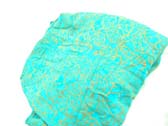 Golden art print design on turquoise colored bali sarong