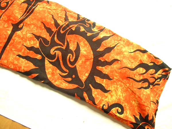 Export apparel outlet, Fiery orange batik sarong with tribal sun and dolphin image