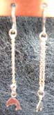 Studs genius sterling silver ear clip earring with long chain holding 