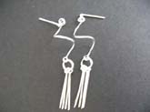 Studs Thailand made 925 sterling silver earring with curvy wire holding multi silver pins at the bottom