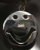 Happy face with cut-out eye hole and mouth design sterling silver pendant